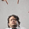 Accusing fingers point at man