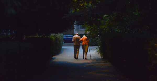 Old couple walk into distance