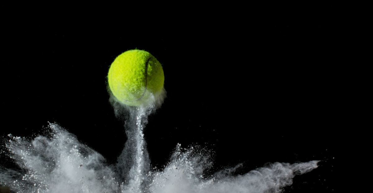 Tennis ball hits chalk