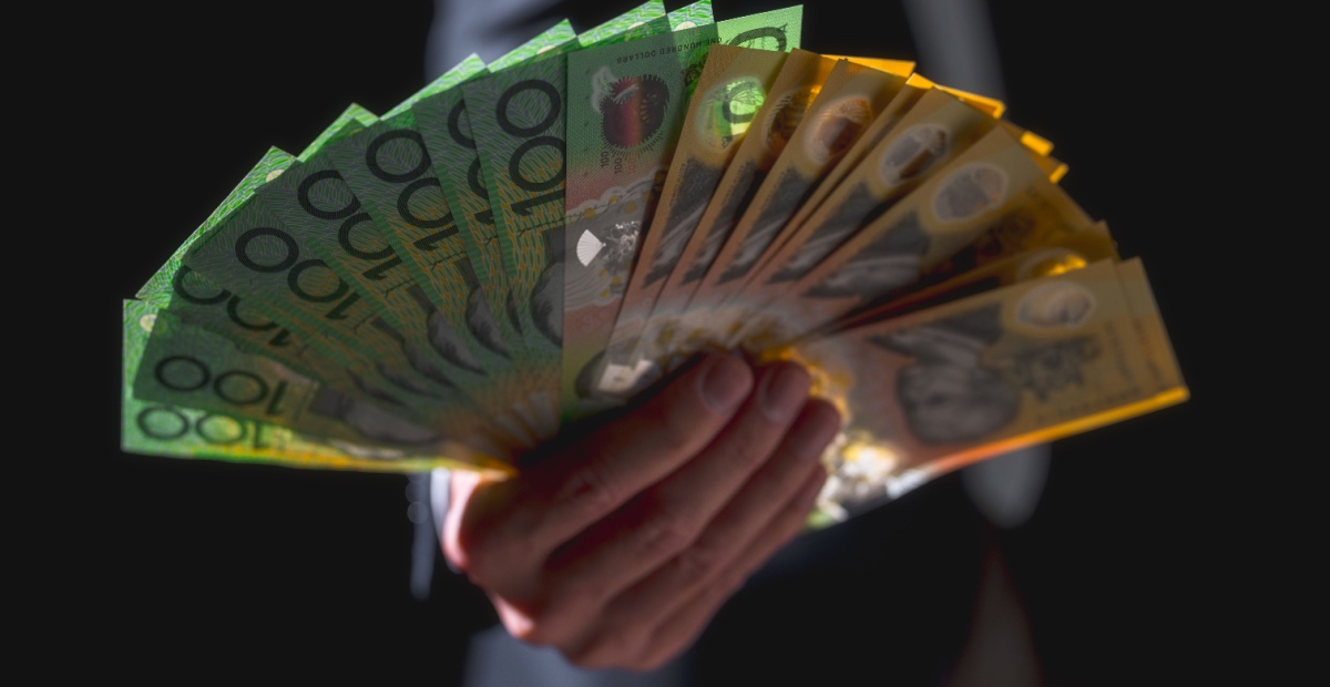 Hand holding currency