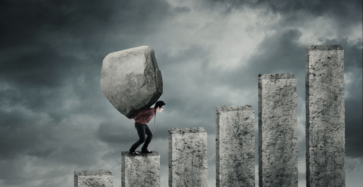 Man carries boulder up steps