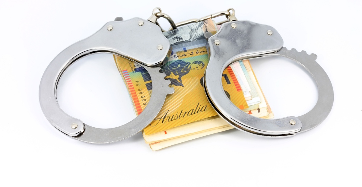 Handcuffs and banknotes