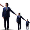 Businessmen pointing to smaller and smaller version