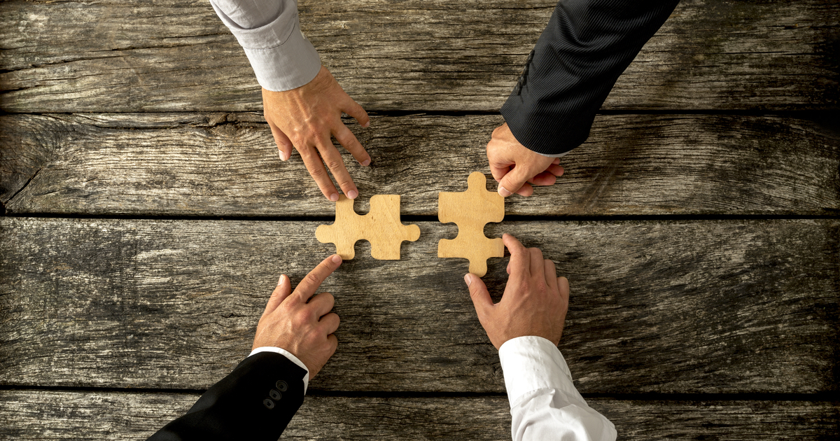 Hands merging pieces