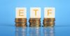 ETF letters sitting on 3 stacks of coins